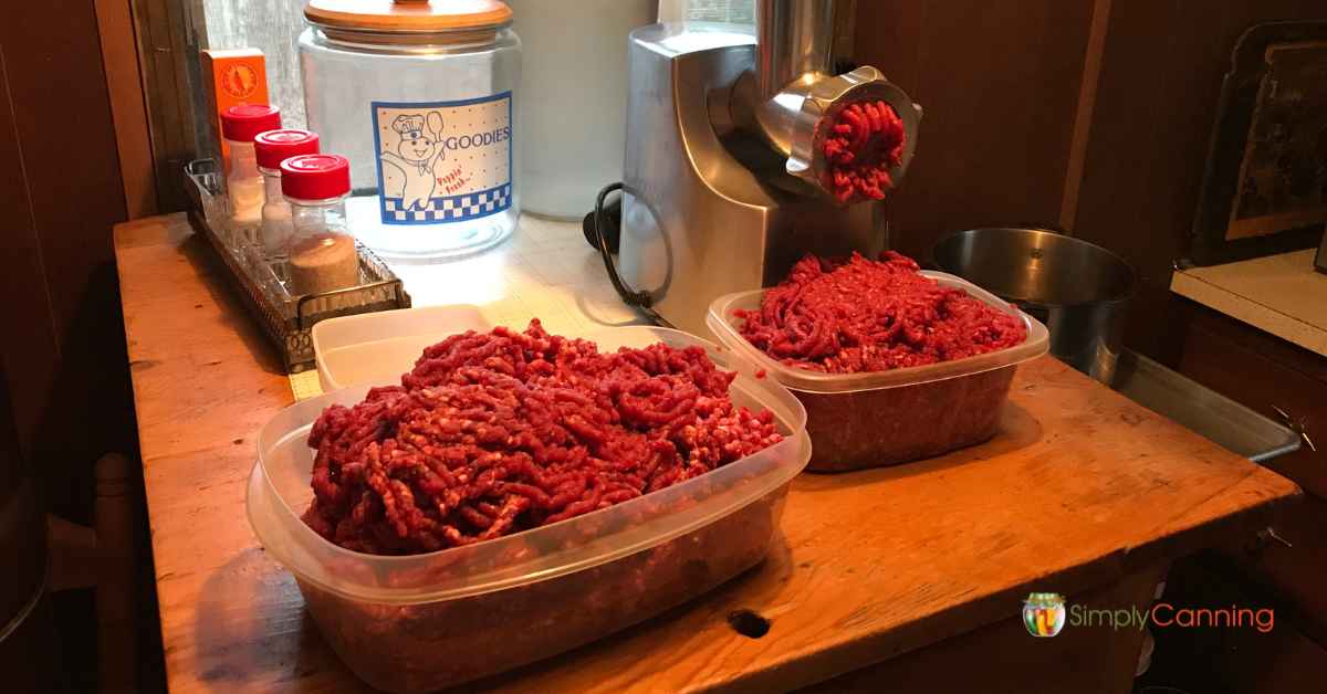 Running venison through a high-powered meat grinder.