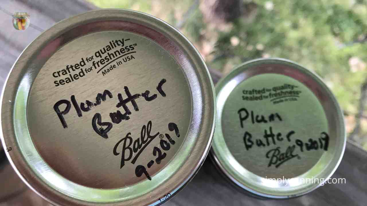 Top of two jars labeled plum butter from 2019.